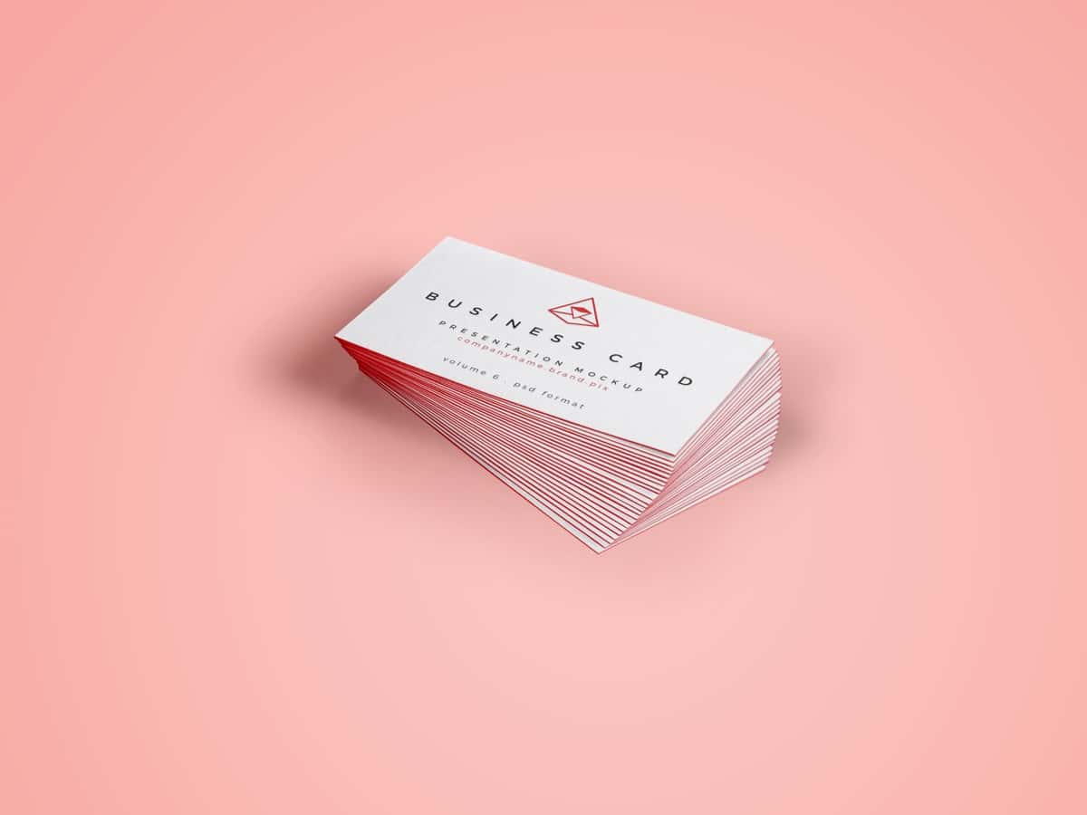 A Set Of Business Cards On A Pink Background.