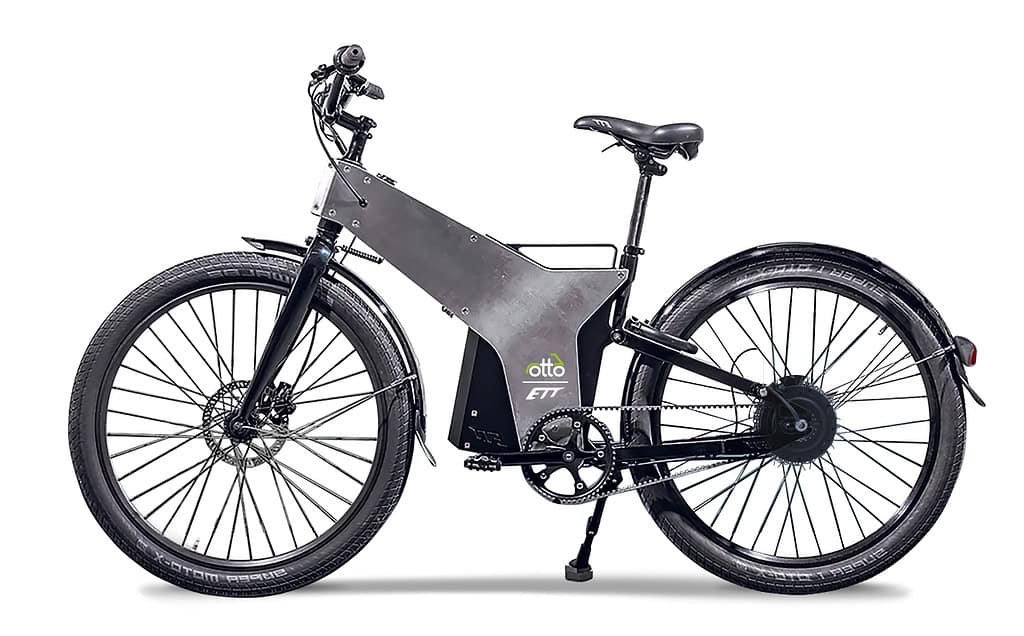 Side view of a sleek black and silver electric bicycle with large tires, sturdy frame, and visible Relay branding on the battery pack—perfect for zipping through London alongside rented scooters.